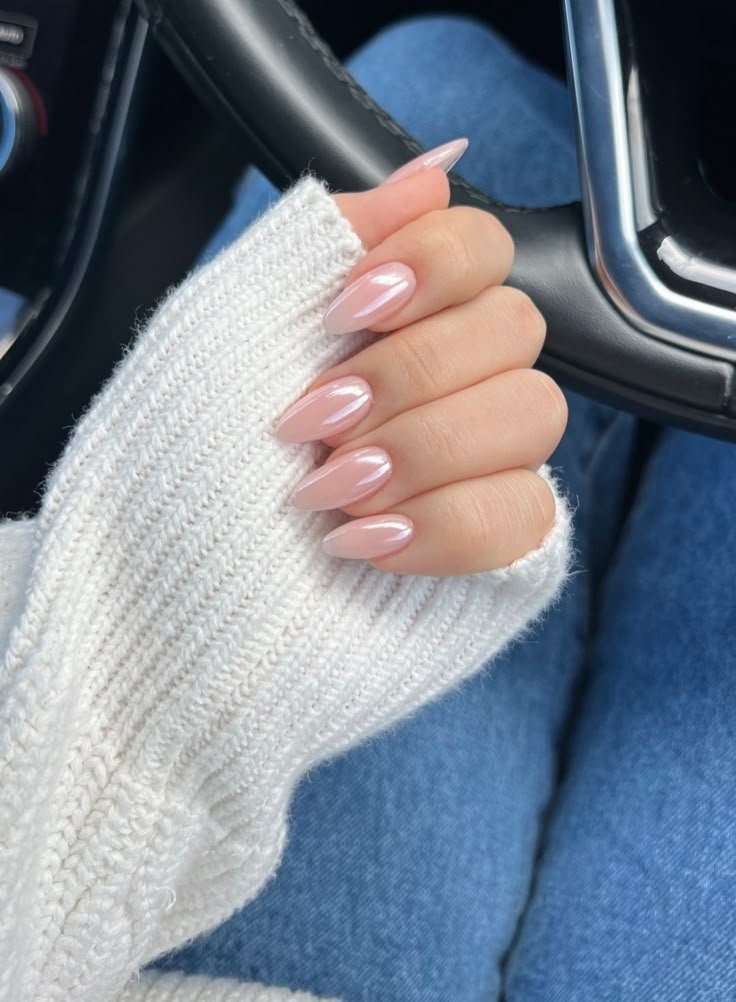Glossy sheer pink almond nails with a natural and romantic finish